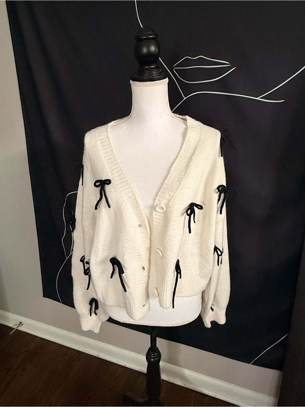 Cream V-Neck Button Cardigan with Black Bow Details